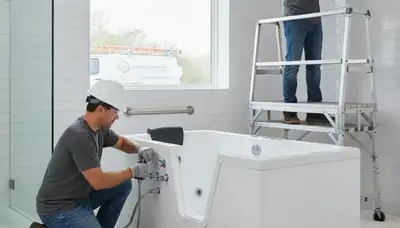 Overland Park, KS plumber installing a walk-in tub for safer home bathing